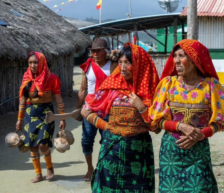 Guna indigenous community members in traditional dress in San Blas Islands Panama