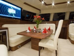Luxury dining area inside SunReef 62 catamaran in San Blas with elegant table setting