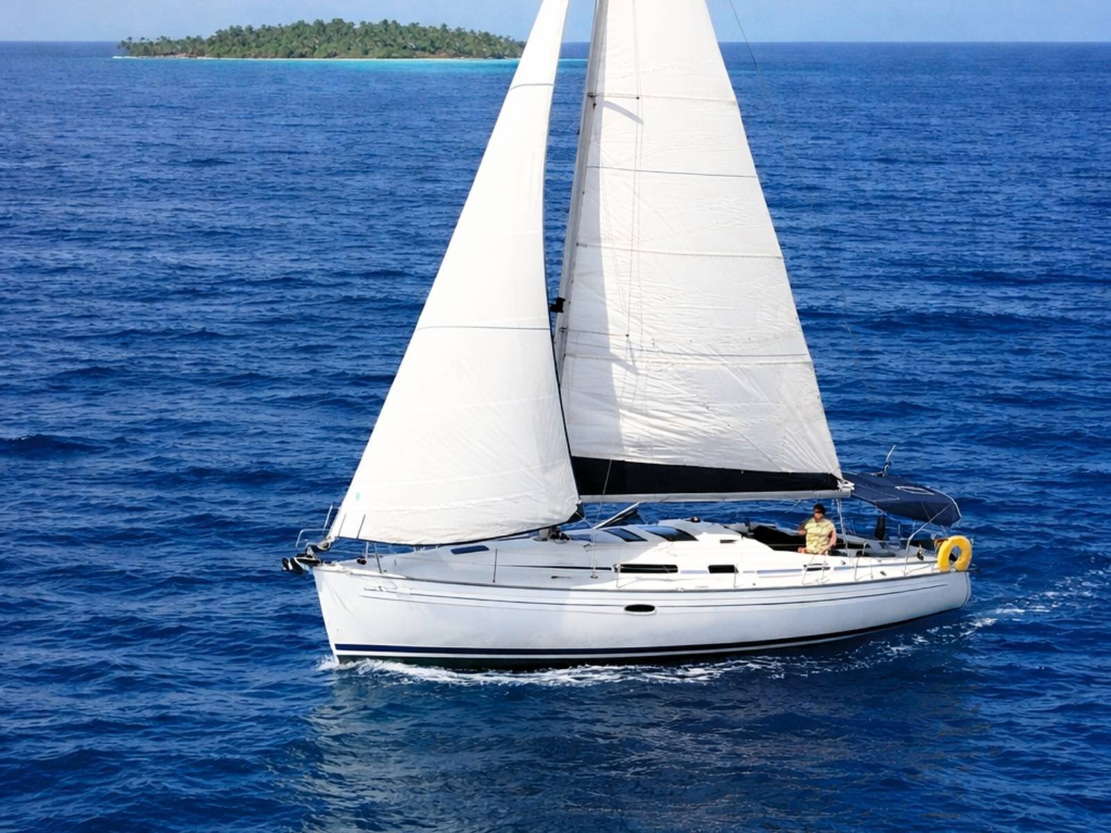 Bavaria 35 sailboat under full sail in the Caribbean waters of San Blas Islands Panama