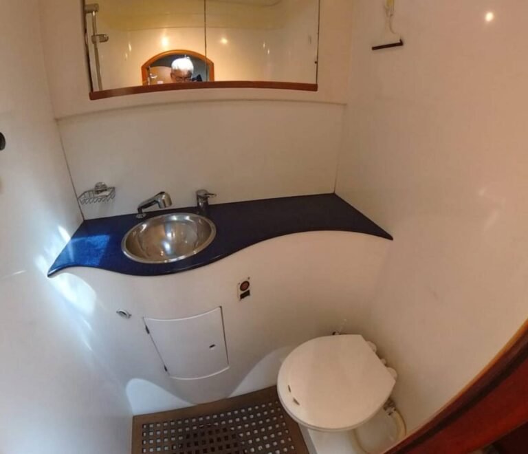 Private bathroom inside Lagoon 57 catamaran cabin in San Blas with shower and modern comfort