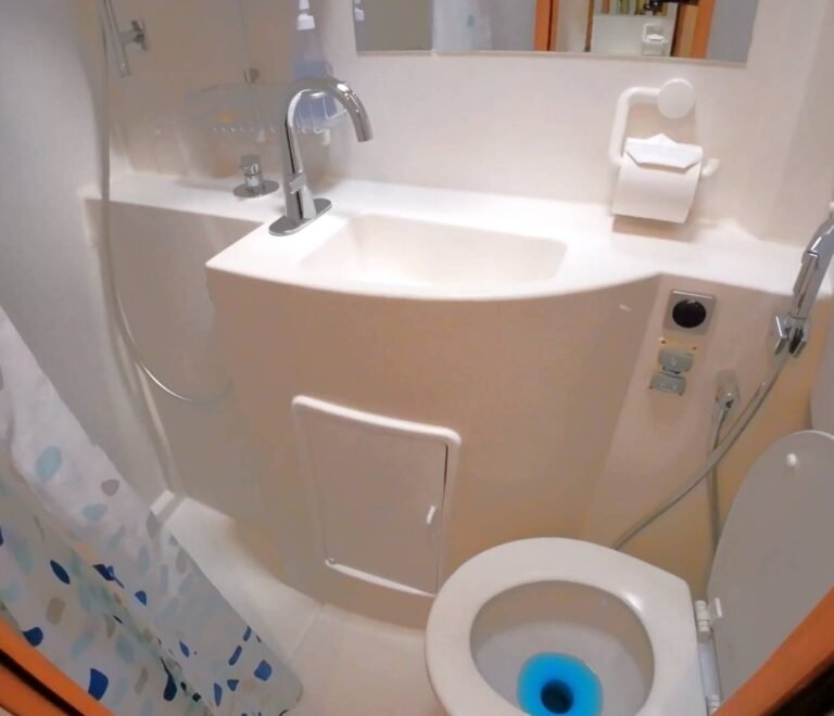 Compact private bathroom with shower aboard catamaran in San Blas Islands Panama