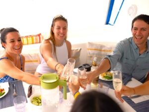Guests enjoying drinks and socializing in the saloon of Fontaine Pajot Salinas 48 catamaran San Blas Panama