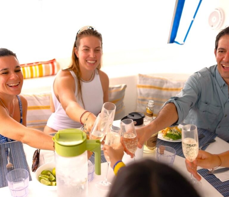 Guests enjoying drinks and socializing in the saloon of Fontaine Pajot Salinas 48 catamaran San Blas Panama