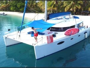 Fontaine Pajot Salinas 48 catamaran anchored at lush tropical island in San Blas Panama
