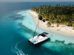 Lagoon 57 catamaran anchored near tropical island in San Blas with turquoise water