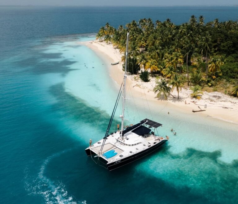 Lagoon 57 catamaran anchored near tropical island in San Blas with turquoise water