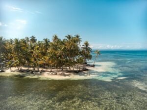 Aerial panoramic view of Chichime cay surrounded by turquoise water in Guna Yala Panama