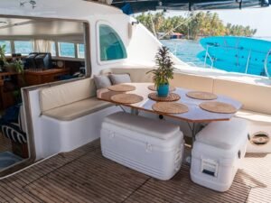Outdoor dining and lounge cockpit on Lagoon 57 catamaran in San Blas