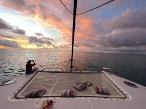 Stunning sunset view from the bow of a catamaran in San Blas Islands Guna Yala Panama