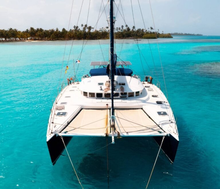 Front view of Lagoon 57 catamaran anchored in turquoise waters of San Blas