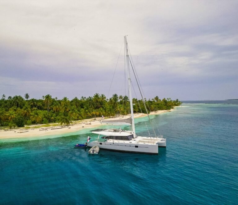 SunReef 62 catamaran anchored in turquoise waters of San Blas Islands