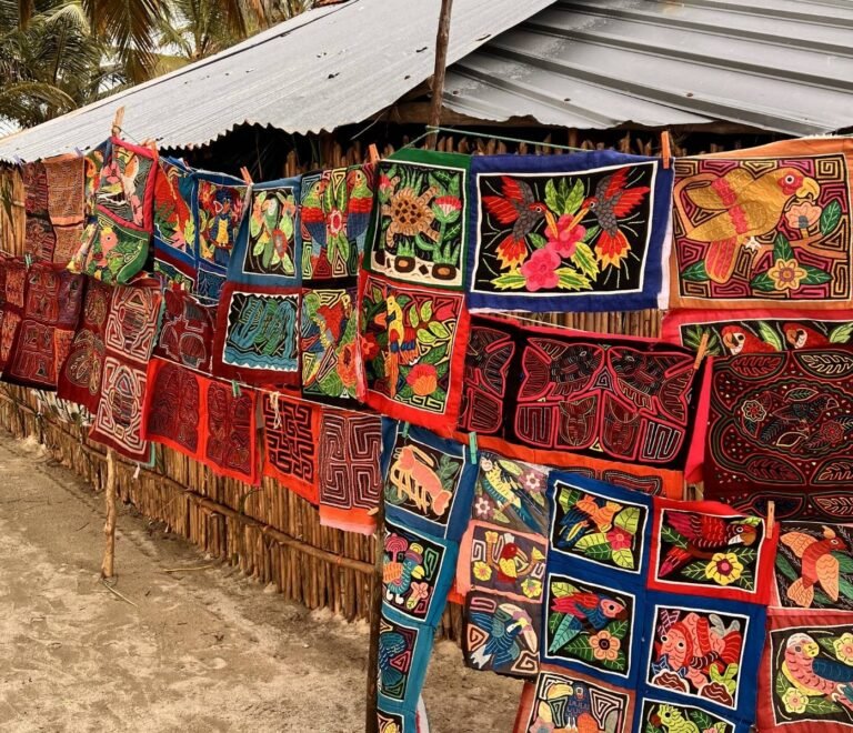 Guna women selling traditional mola textiles to tourists in San Blas Islands Panama