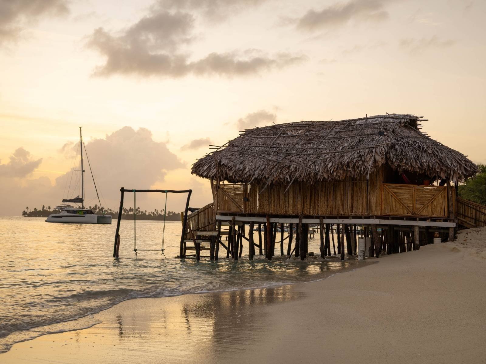 Beachfront bungalow cabin at sunset in Dutch Cays San Blas Panama