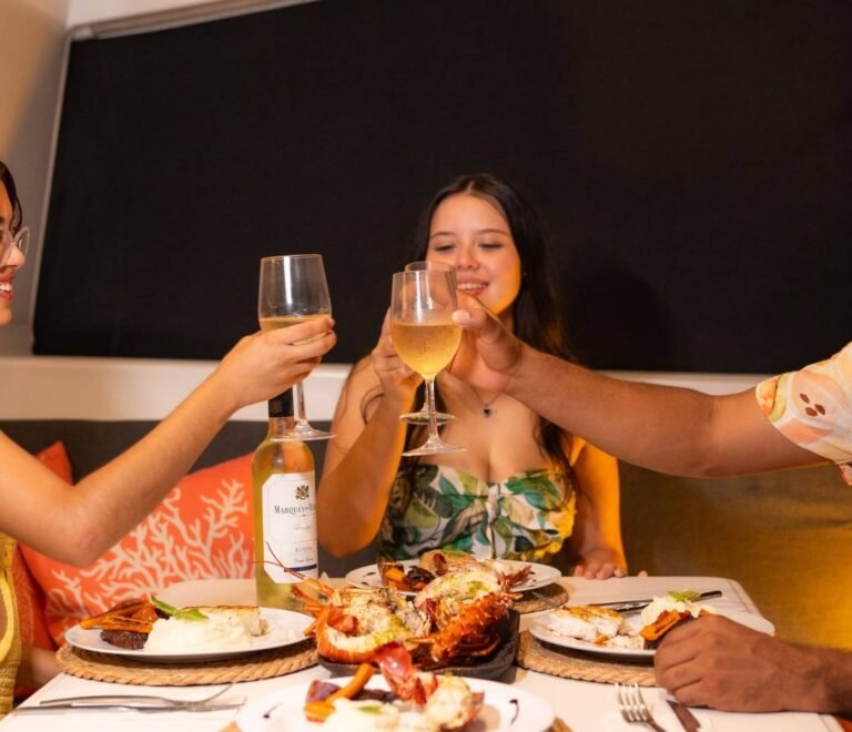 Guests enjoying dinner onboard Lagoon 40 catamaran in San Blas