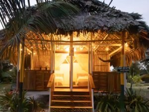Illuminated deluxe cabin exterior at night in Dutch Cays San Blas