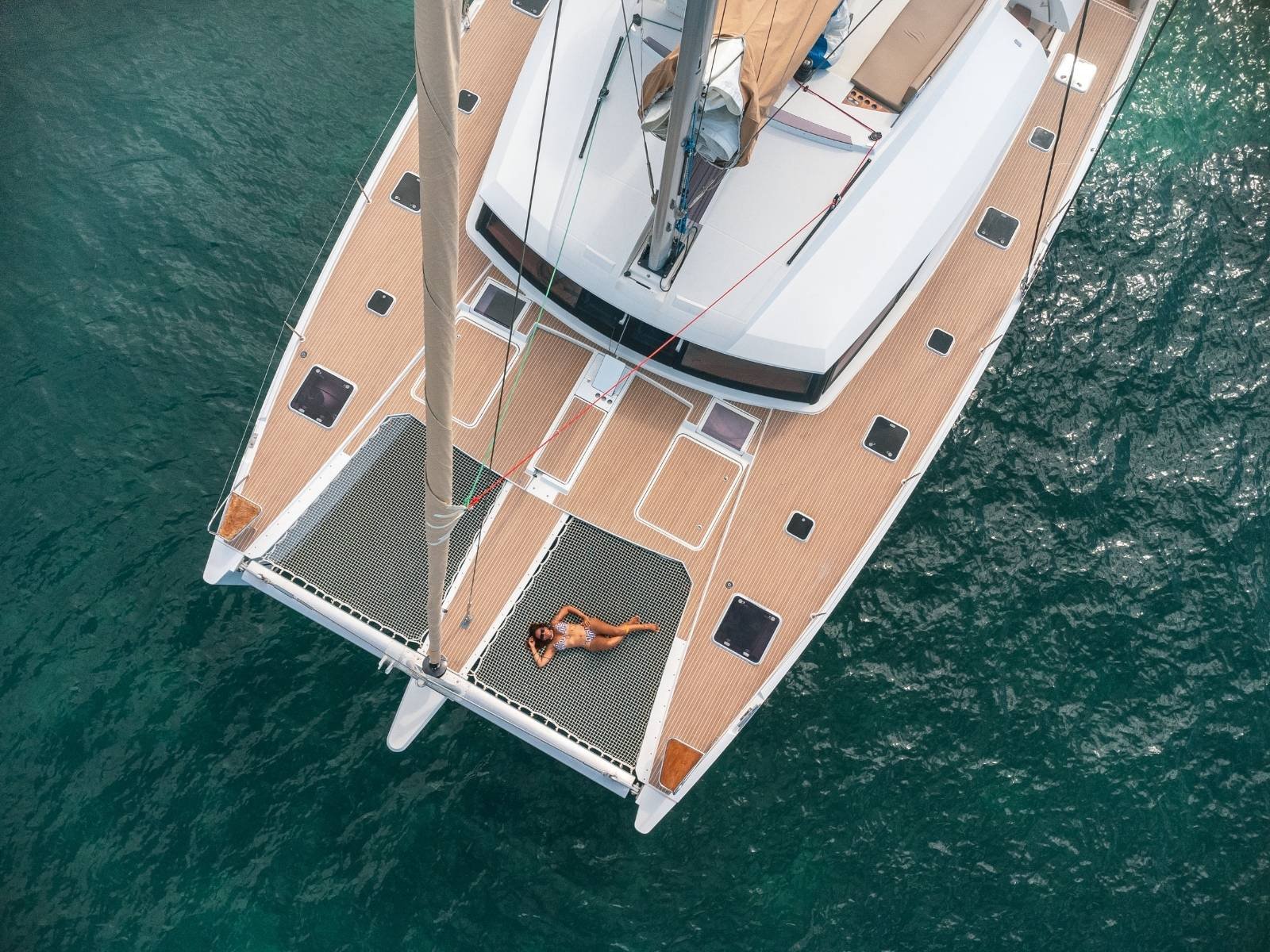 Front nets and sunbathing deck on Ipanema 58 catamaran in San Blas aerial view