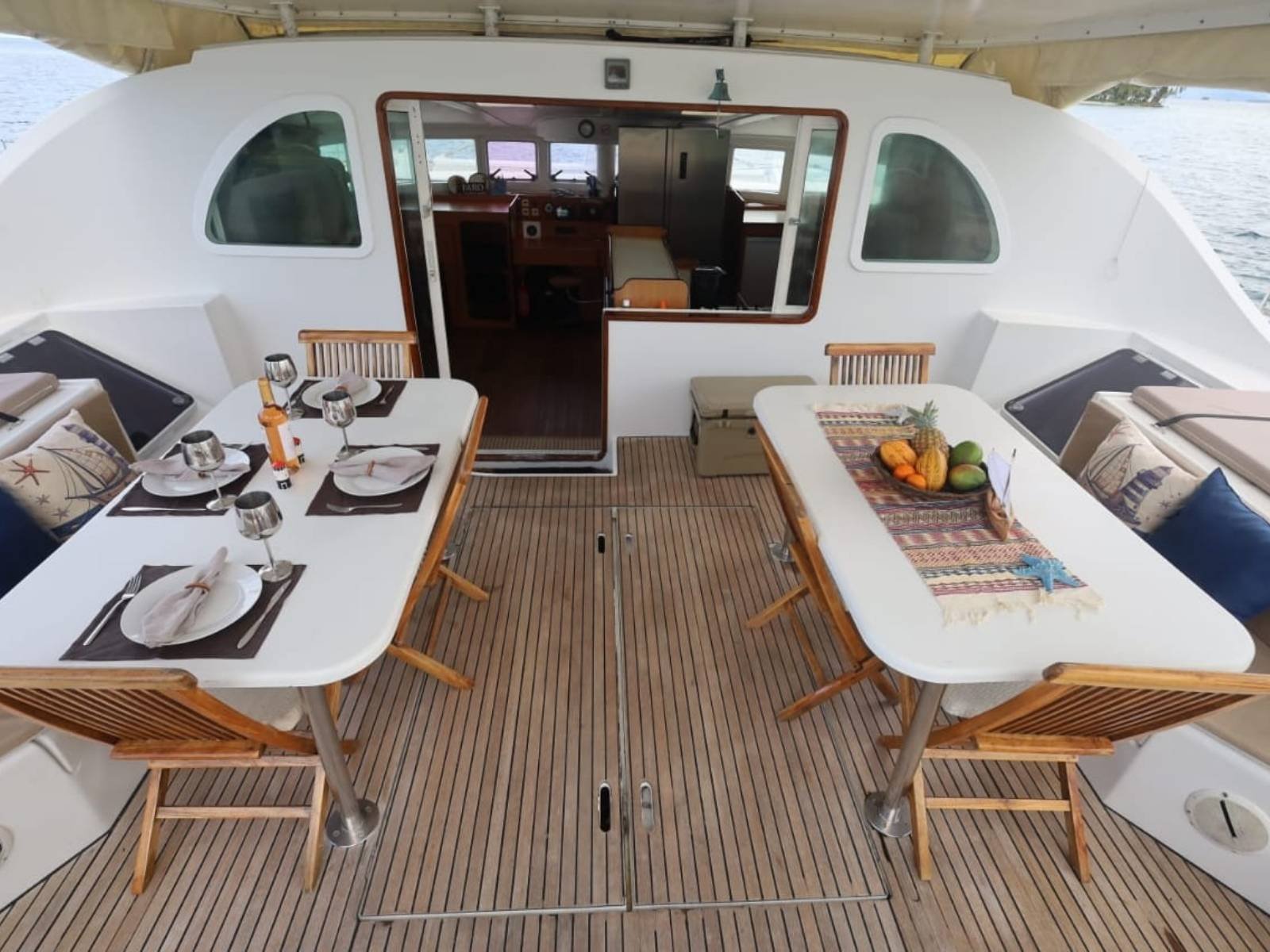 Outdoor cockpit dining area on Lagoon 57 catamaran in San Blas