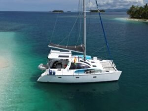 Lagoon 37 catamaran anchored in crystal clear waters of San Blas Panama