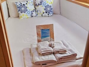 Comfortable guest cabin on Lagoon 40 DO catamaran in San Blas with fresh towels