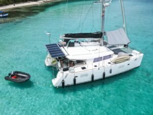 Lagoon 400 DO catamaran anchored in turquoise waters of San Blas aerial view