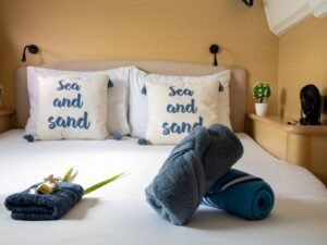 Private cabin detail inside Lagoon 440 catamaran in San Blas with fresh towels