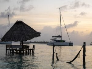 Hammock with catamaran view at sunset in Dutch Cays San Blas