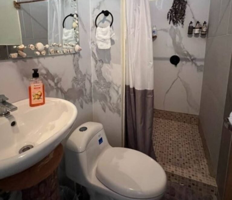 Private bathroom with shower inside deluxe cabin in Dutch Cays San Blas