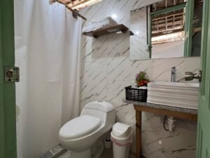 Private bathroom with shower inside bungalow cabin in Dutch Cays San Blas