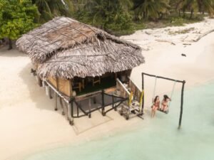 Aerial view of beachfront bungalow cabin in Dutch Cays San Blas