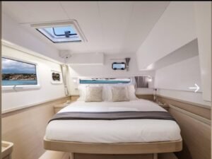 Master cabin inside Lagoon 42 catamaran in San Blas with queen bed and modern design