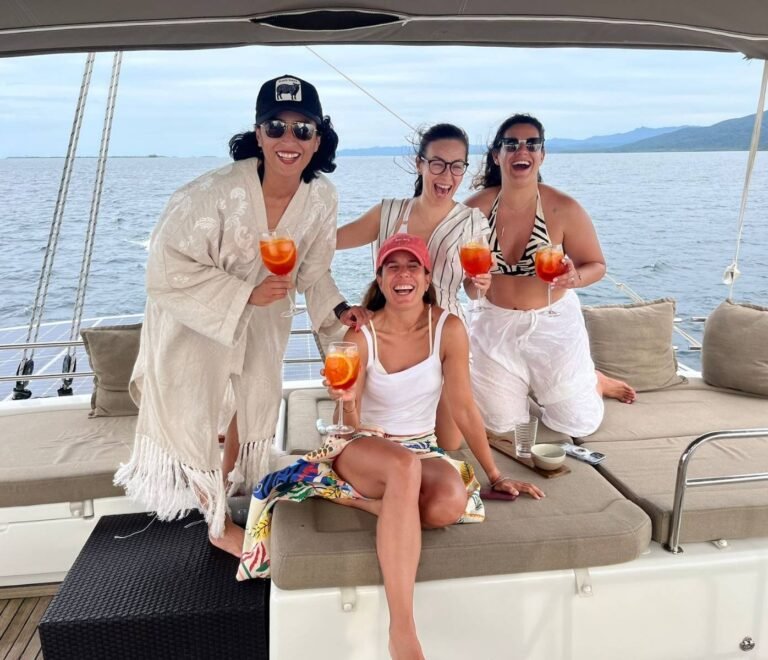 Guests enjoying cocktails onboard Lagoon 56 catamaran in San Blas