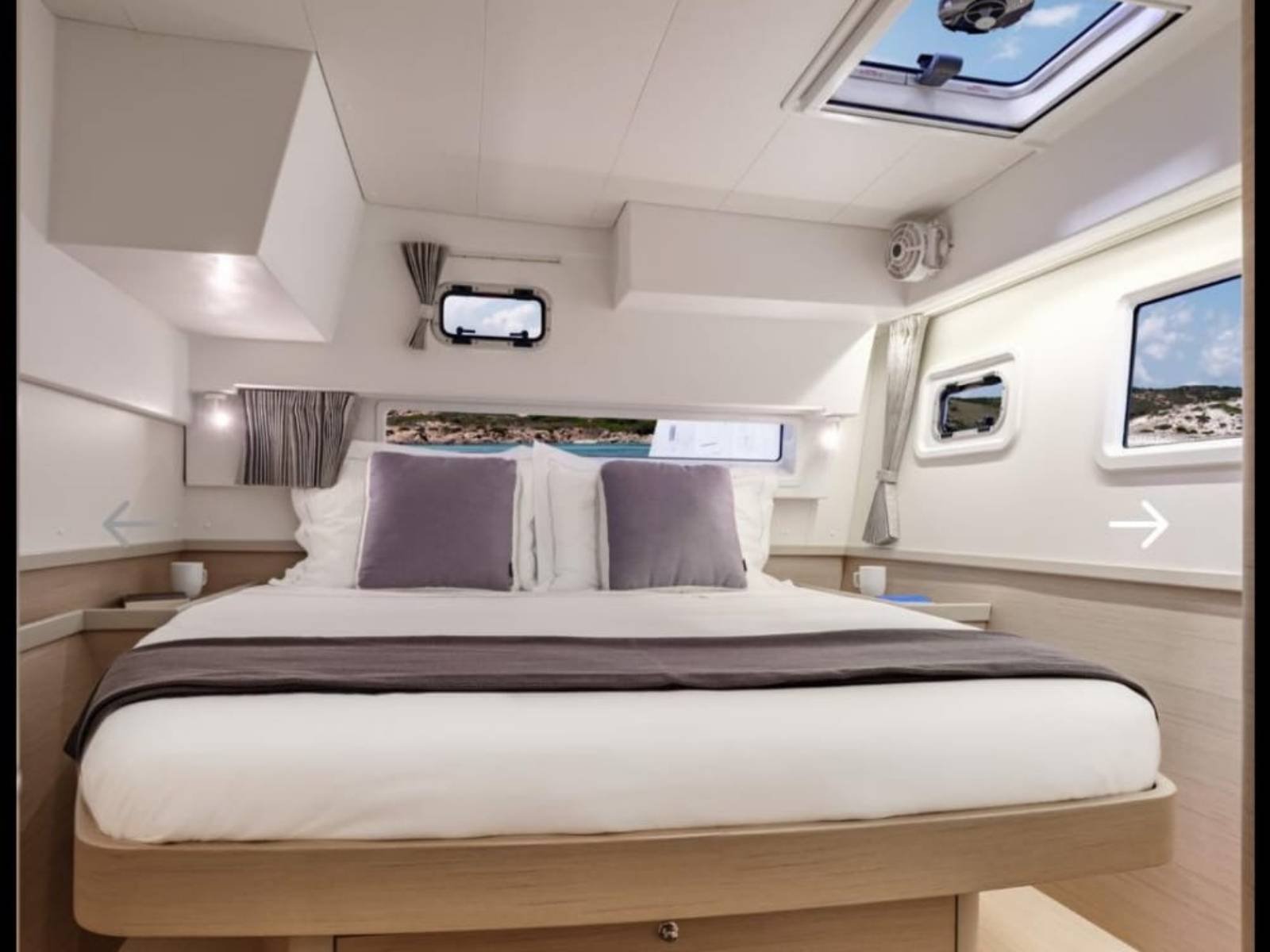 Master cabin with queen bed inside Lagoon 42 catamaran in San Blas