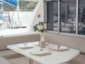 Interior dining area inside Leopard 40 catamaran in San Blas with sea view