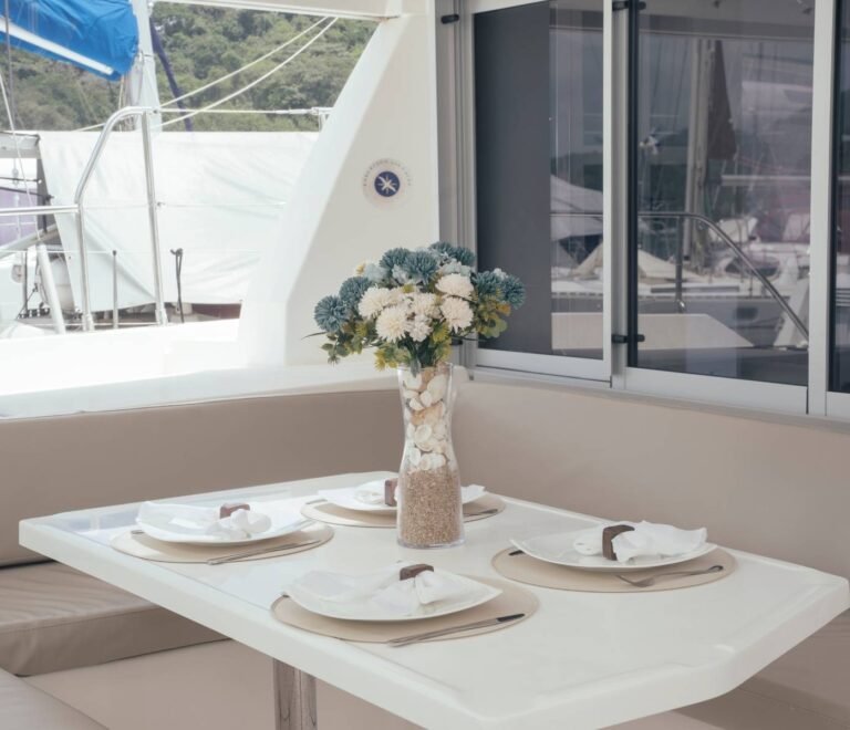 Interior dining area inside Leopard 40 catamaran in San Blas with sea view