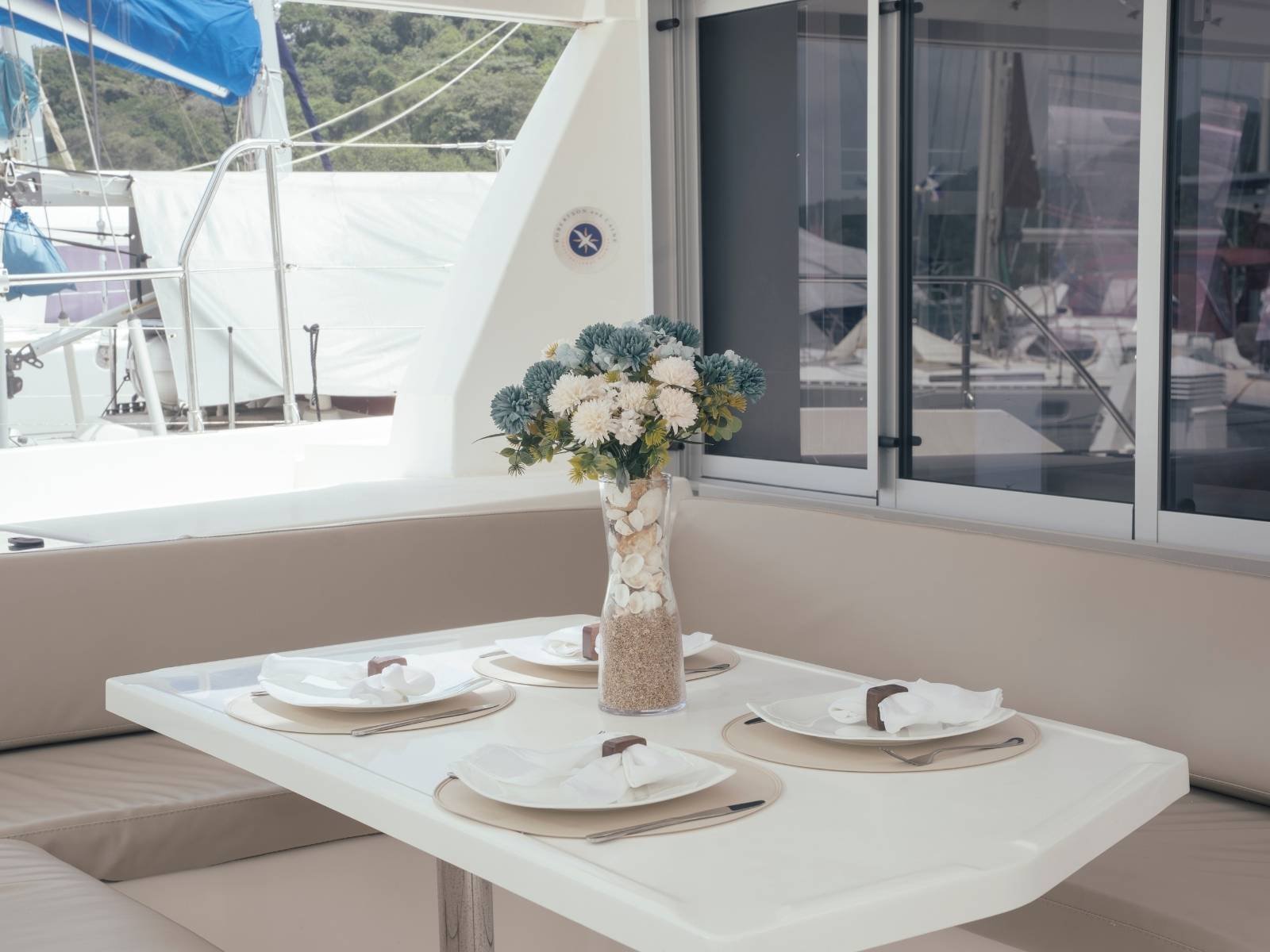 Interior dining area inside Leopard 40 catamaran in San Blas with sea view