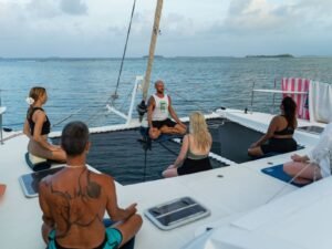 Meditation session at sunset onboard catamaran retreat in San Blas