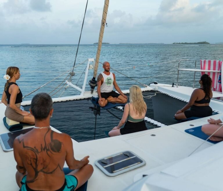 Meditation session at sunset onboard catamaran retreat in San Blas