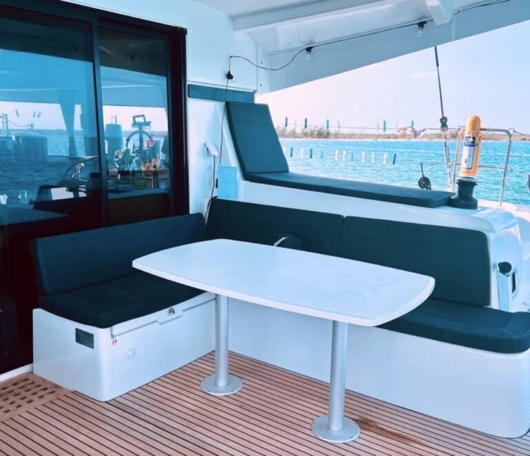 Outdoor cockpit dining area on Lagoon 42 catamaran in San Blas with sea views