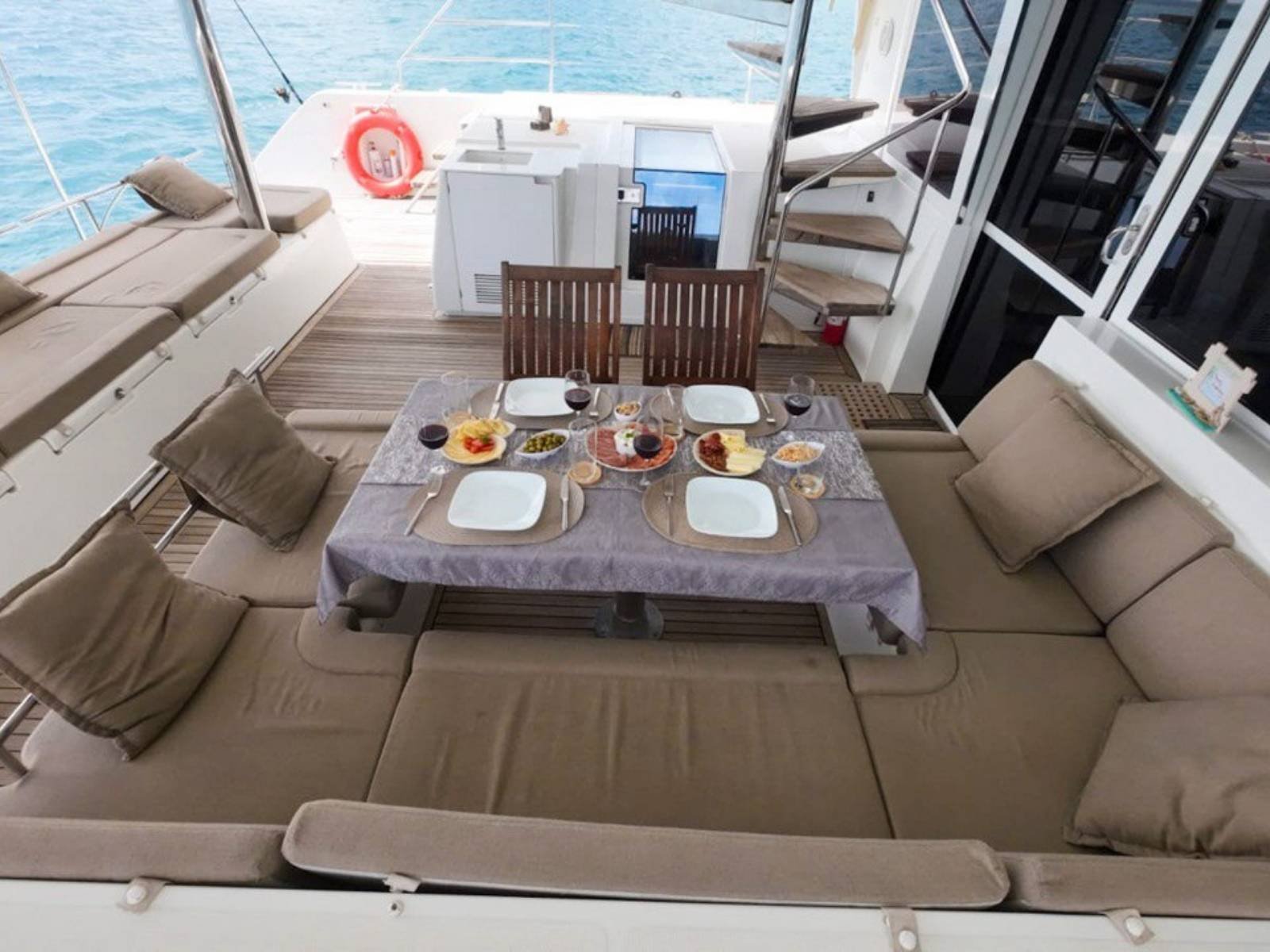Outdoor dining cockpit on Lagoon 56 catamaran in San Blas with sea views
