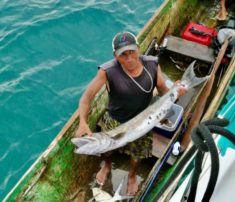 Local Guna fisherman with fresh catch in San Blas Islands Panama