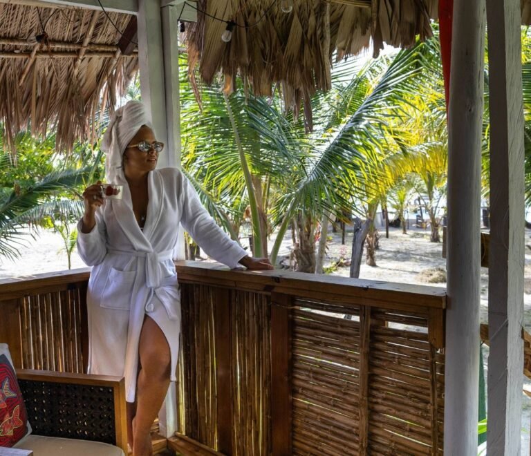 Guest enjoying private terrace of deluxe cabin in Dutch Cays San Blas