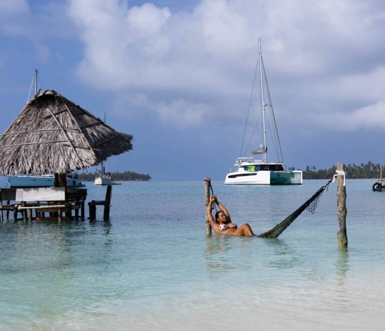Hammock over the sea with catamaran view in Dutch Cays San Blas Panama